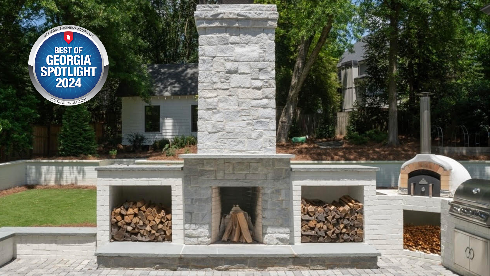Award-winning outdoor fireplace and kitchen project by RDL Hardscapes